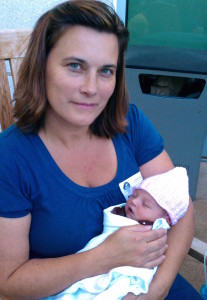 Midwife Christine Strothers holding Cheyenne
